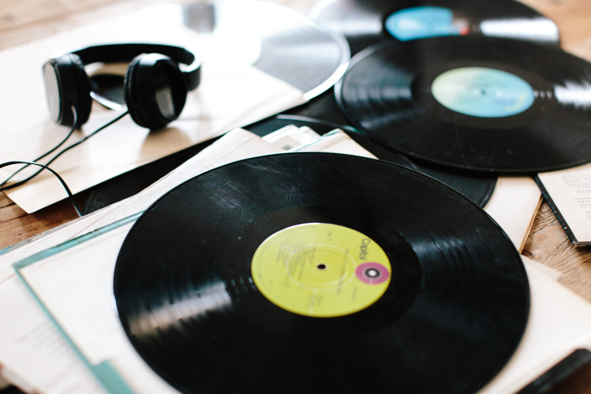 Vintage vinyl records stacked together, symbolizing how memories and emotions shape resilience in adversity